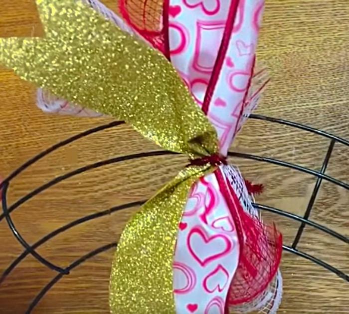 Make a cute cheap DIY Mesh Wreath with materials from Dollar Tree