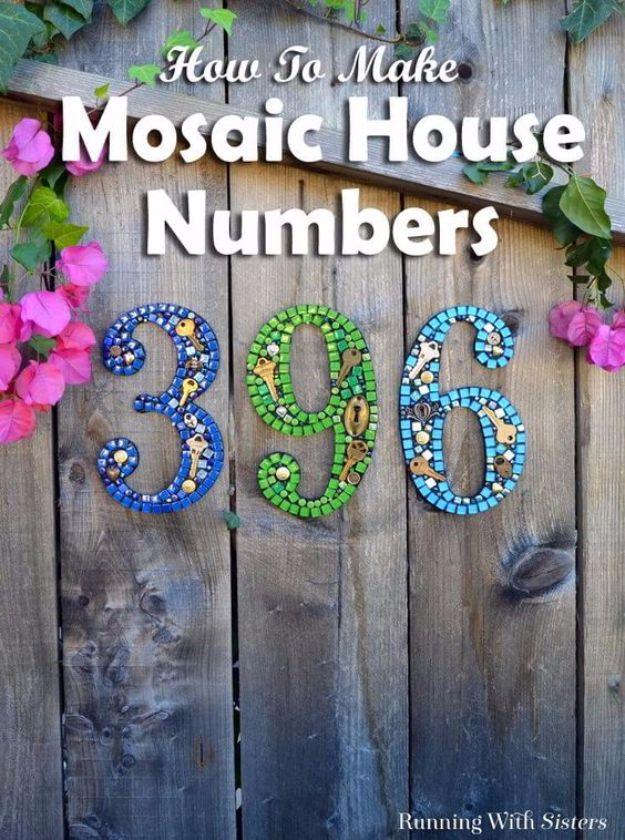 Mosaic DIY house numbers made from tiles, keys and beads set in silicone, mounted on weathered barn wood
