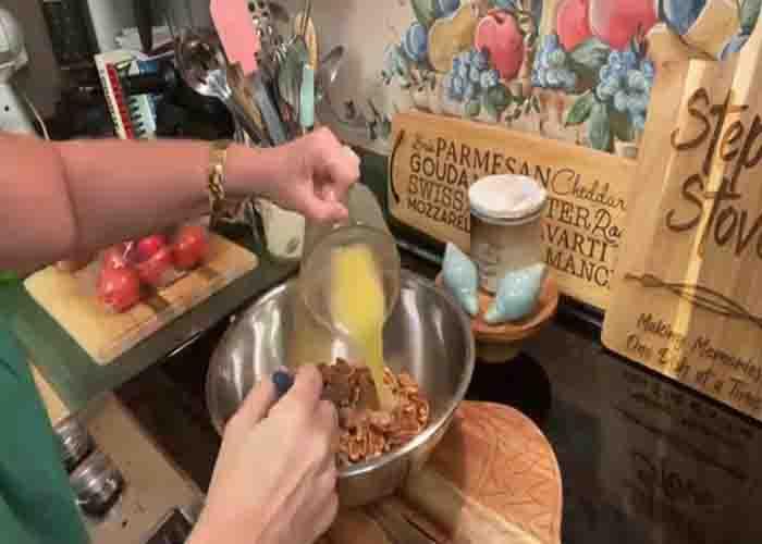 Adding the butter to the pecans