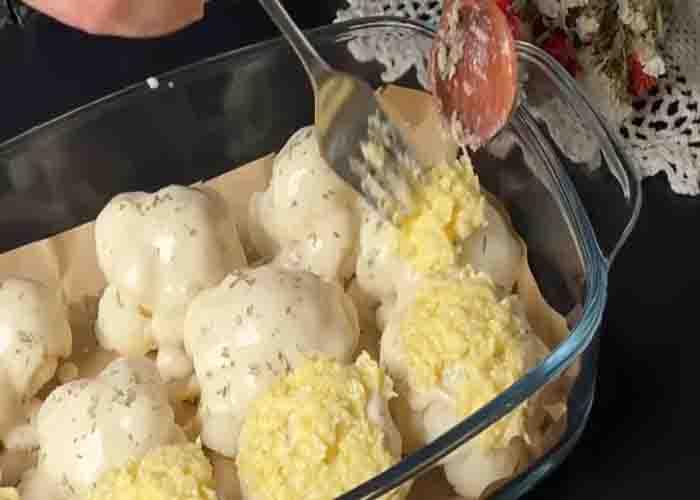 Assembling the cauliflower casserole before baking