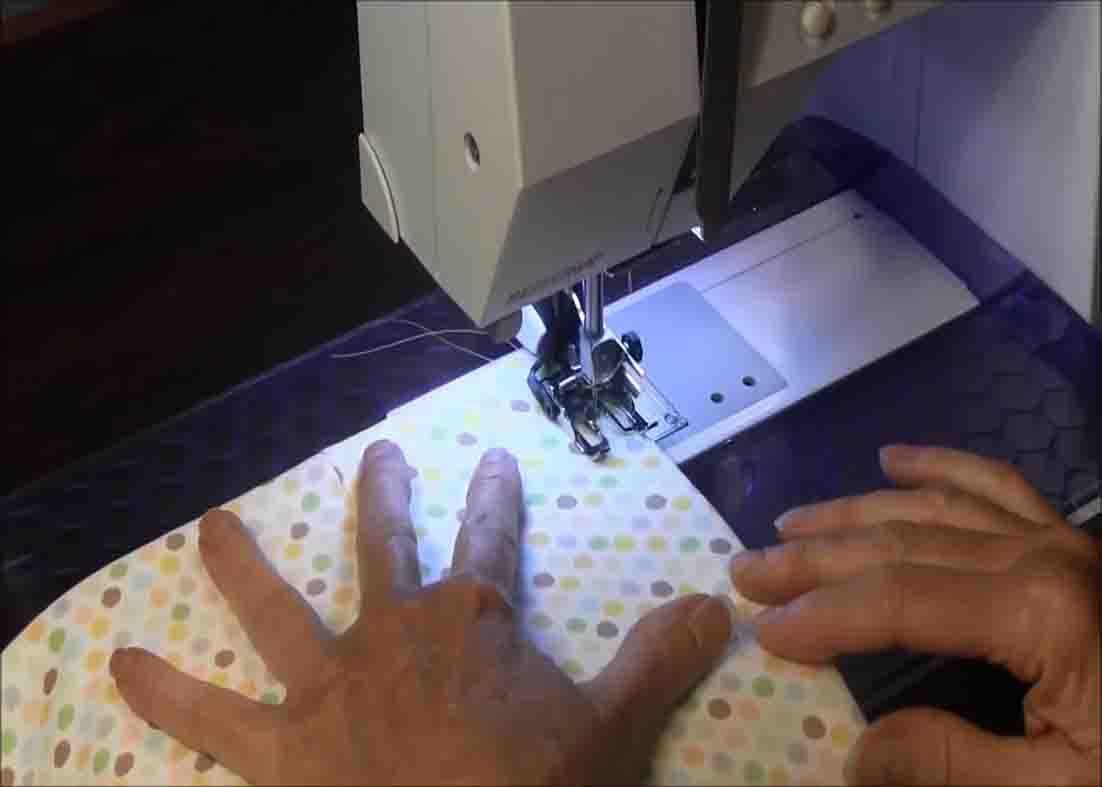 Sewing the quilt project close to finish the pillowcase quilt method