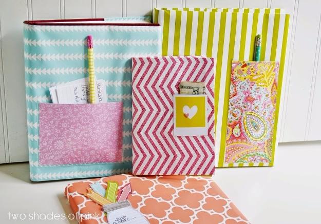 Notebooks covered in teal, red chevron, yellow stripe and paisley wrapping paper with a laminated pencil pocket