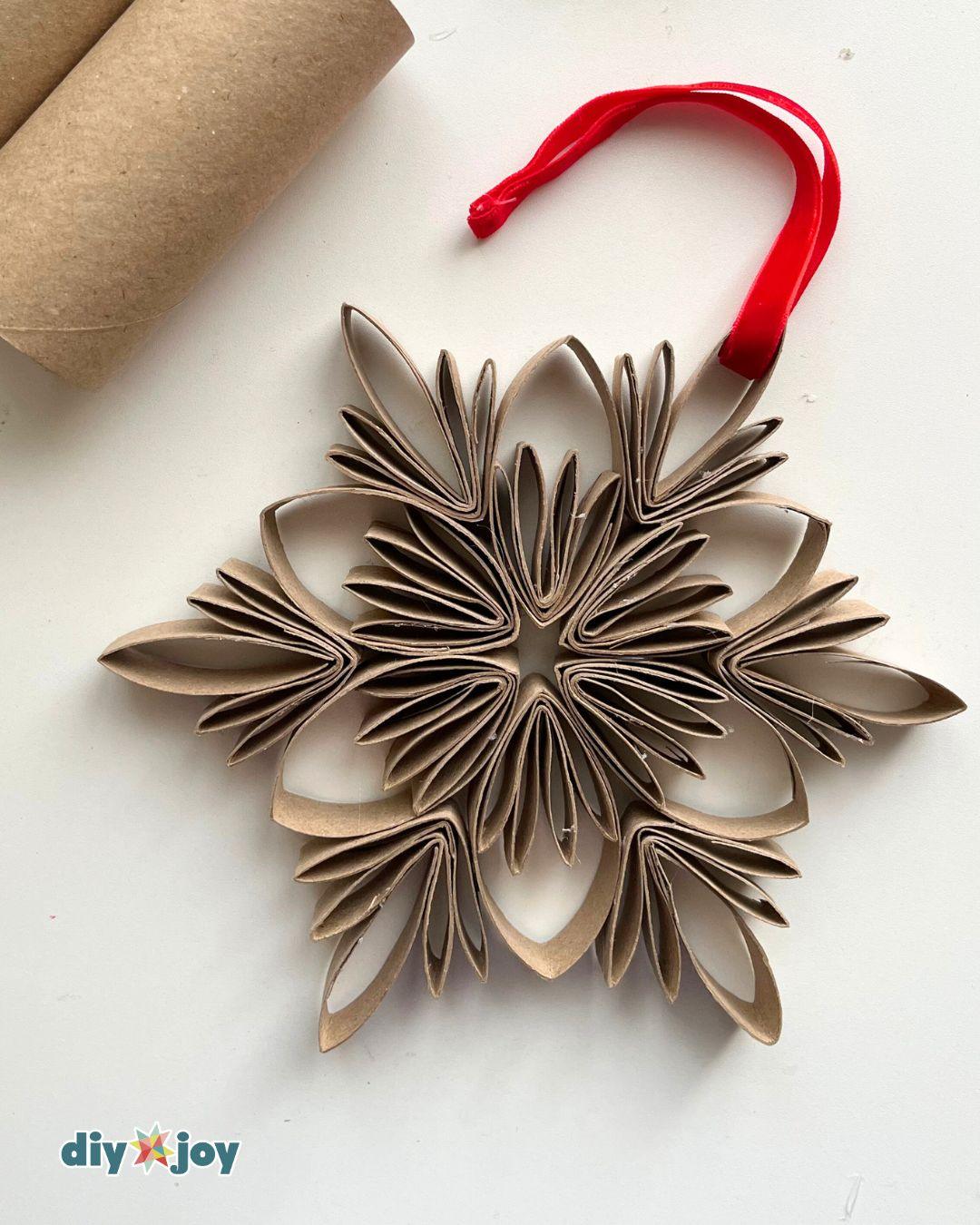 Christmas Ornaments Snowflake Toilet Paper Tubes — adding a string