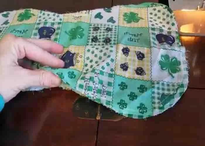 Stuffing the neck bone pillow with stuffing