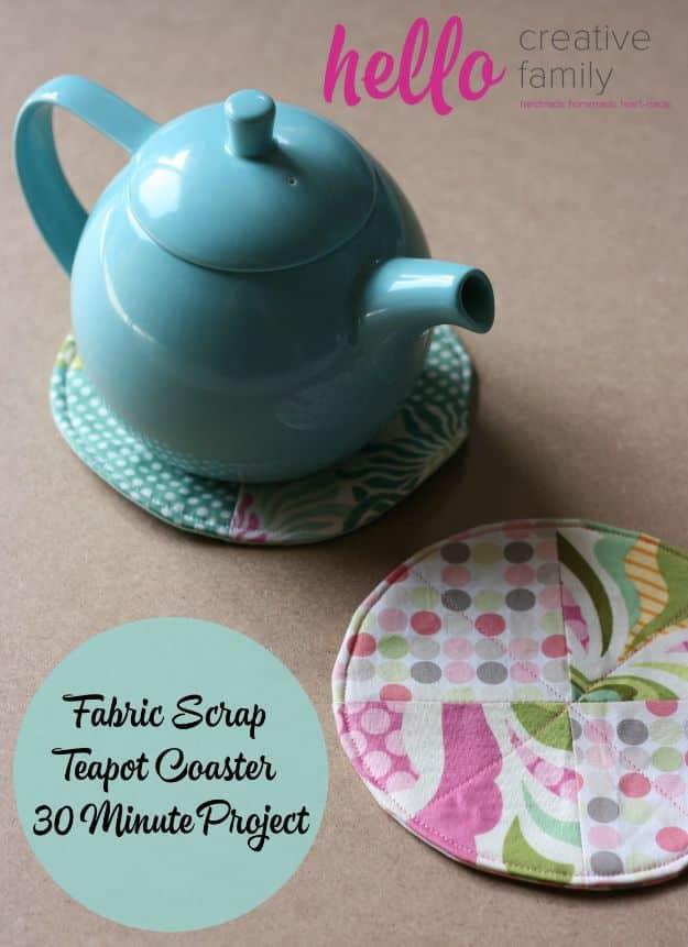 Fabric scrap teapot coaster, a turquoise teapot resting on a round patchwork coaster with a second floral coaster alongside