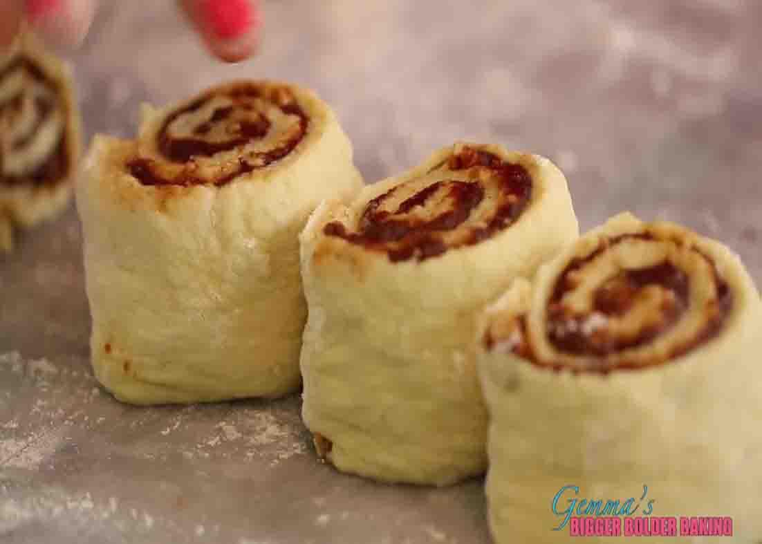 Cutting the cinnamon rolls