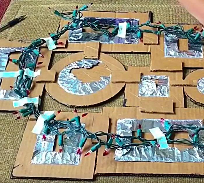 Use old Christmas lights to make a MCM wall art light