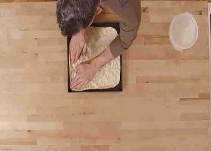 Assembling the grandma pizza