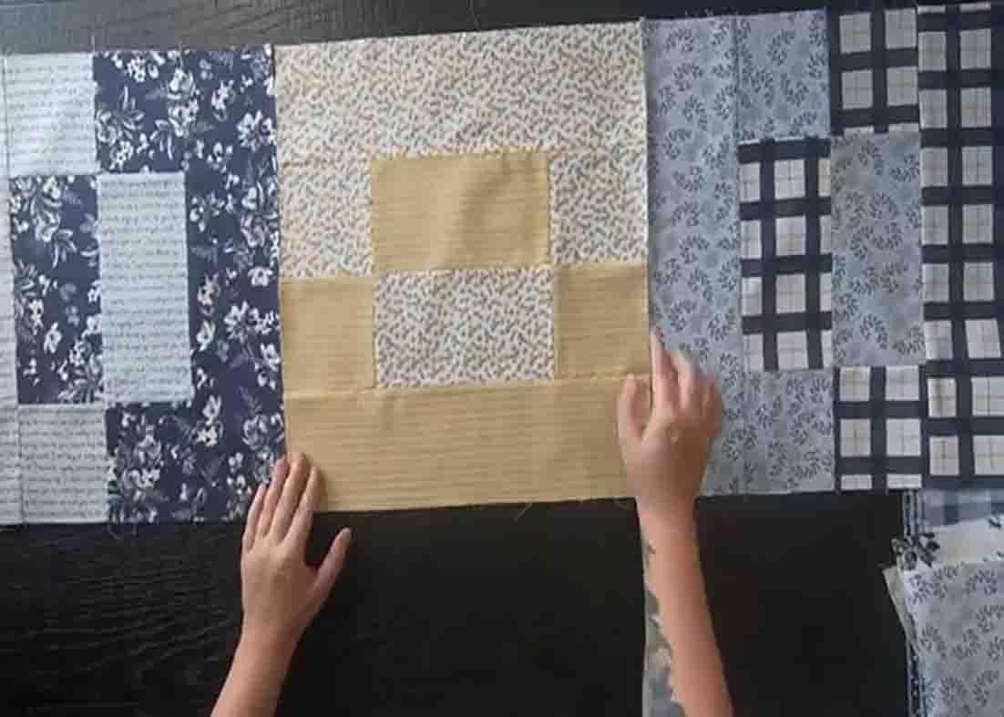Laying up the blocks to form the padlock quilt top