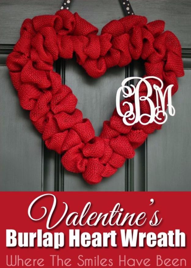 Burlap heart wreath with a couples monogram hanging on a front door, a rustic DIY Valentine decoration