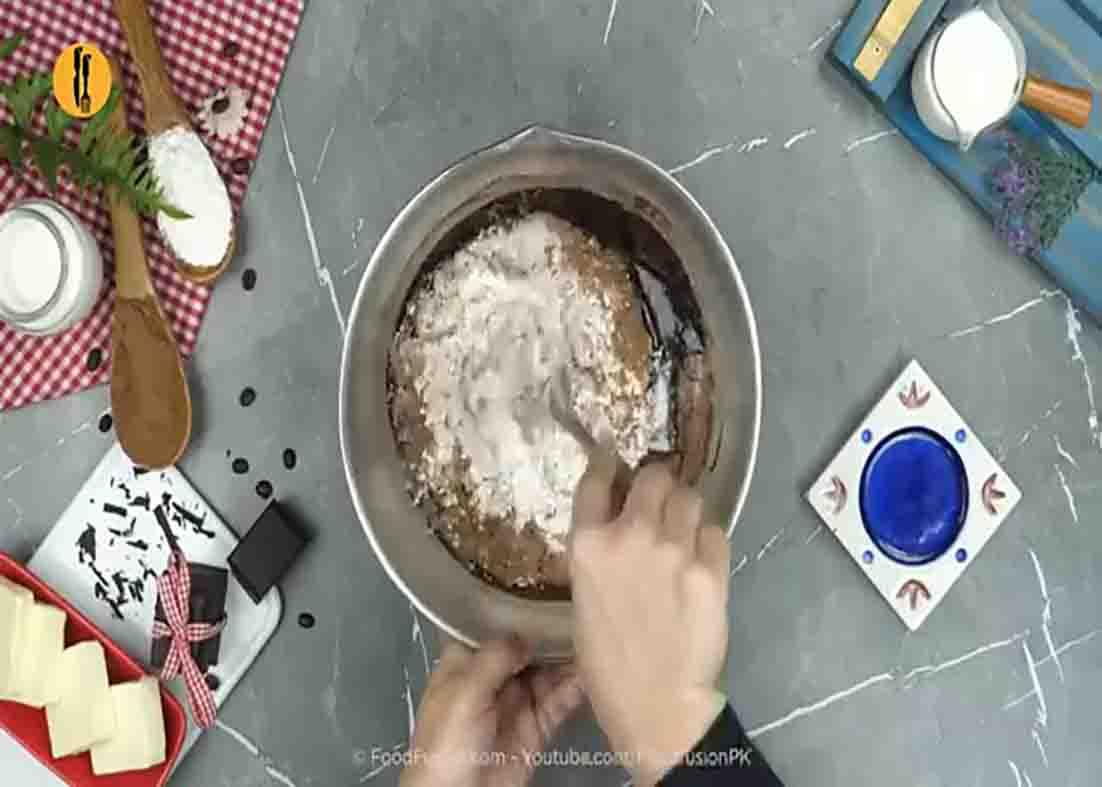 Mixing all the ingredients for the brownie cake dessert
