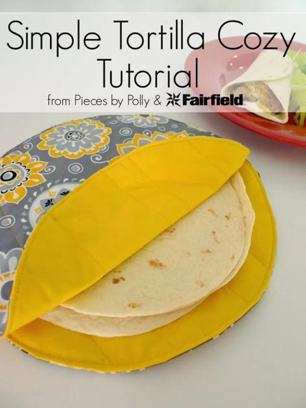 Gray and yellow quilted tortilla cozy folded open with warm flour tortillas inside, shown under a title band