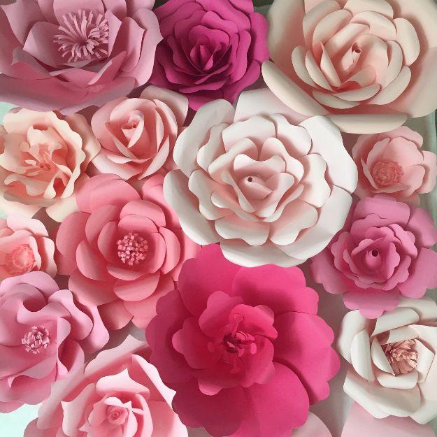 Paper flower backdrop, a whole wall packed edge to edge with cream, blush and deep pink giant paper roses