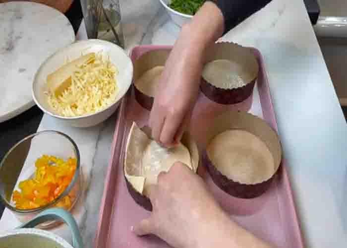 Copycat Panera Egg Souffle - assembling the puff pastry egg souffle cups before baking
