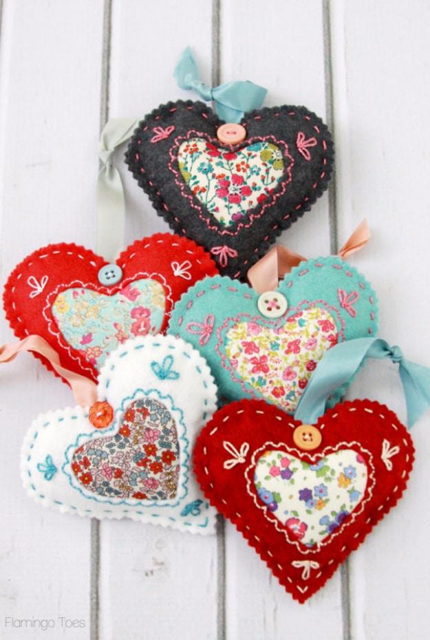 Small fabric heart sachets in mixed prints with trim, easy handmade Valentine's Day gifts to sew for a handmade gift
