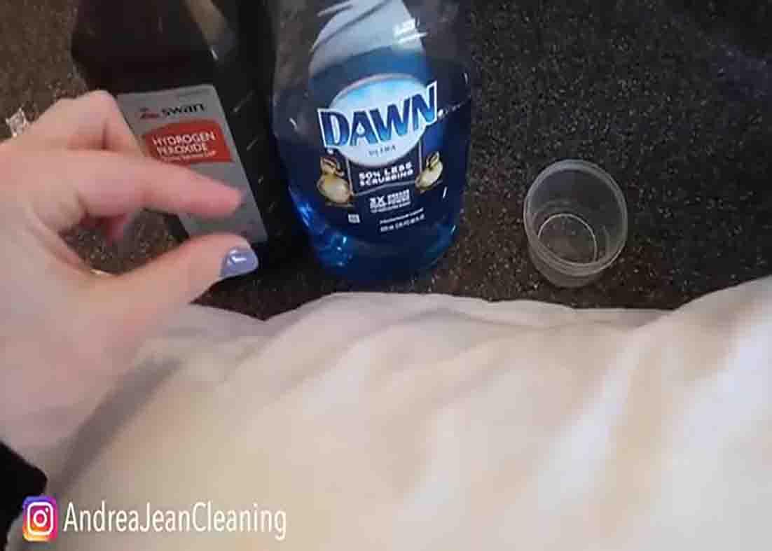 Spot cleaning the yellowed pillows before washing them
