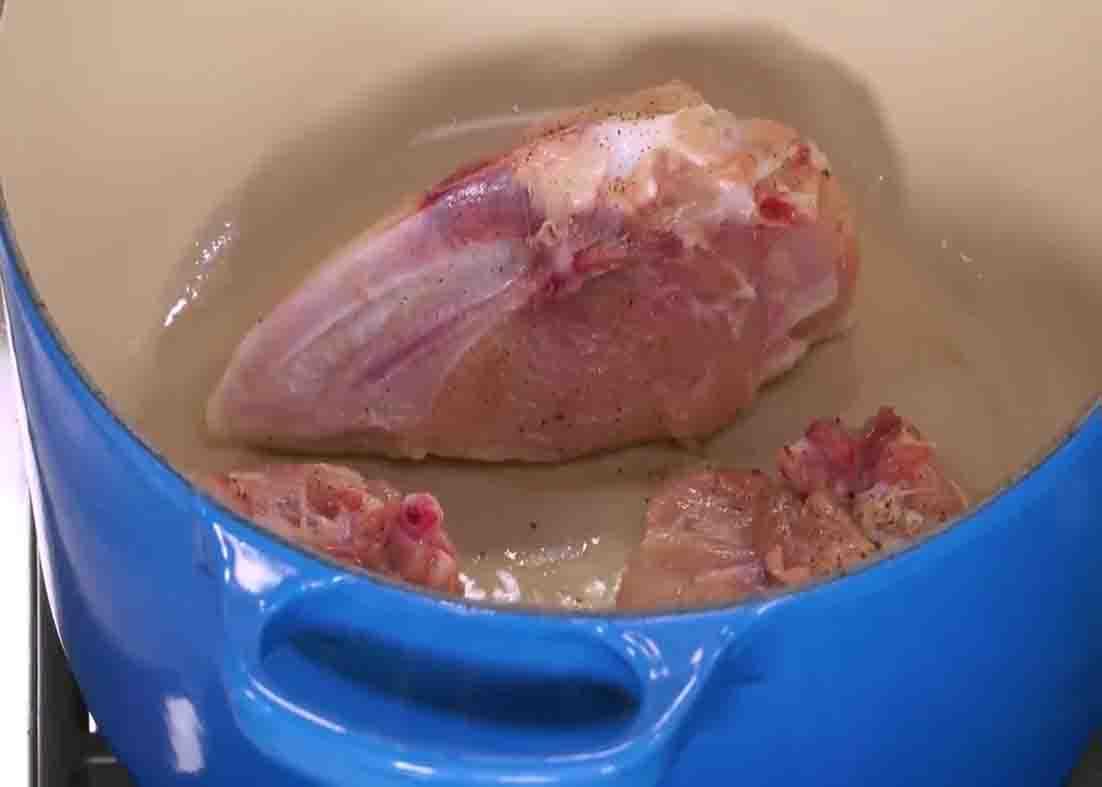 Browning the chicken on both sides for the chicken noodle soup recipe