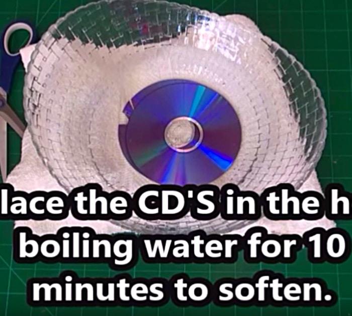 Learn to make this quick easy DIY Disco Ball Christmas Ornament using old CDs
