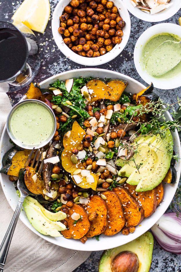 Sweet potato, squash and kale buddha bowl with roasted squash, avocado, chickpeas and green dressing