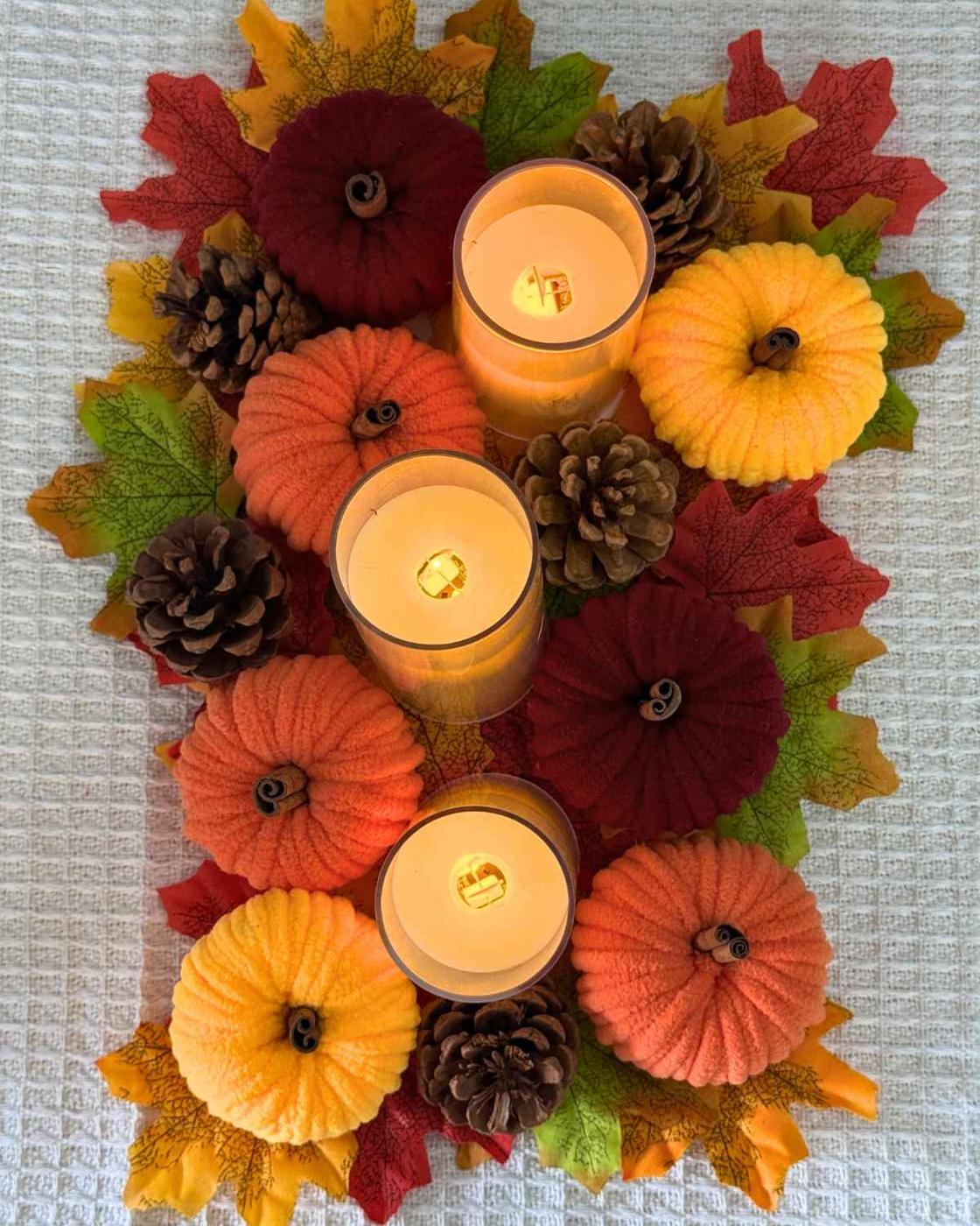 Fall Crafts - finished yarn pumpkin made from a wrapped toilet paper roll, an easy budget friendly fall craft.