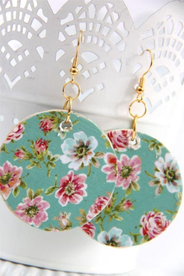 Floral wooden circle earrings, two large teal wood discs papered in a pink and white rose print on gold fish hooks