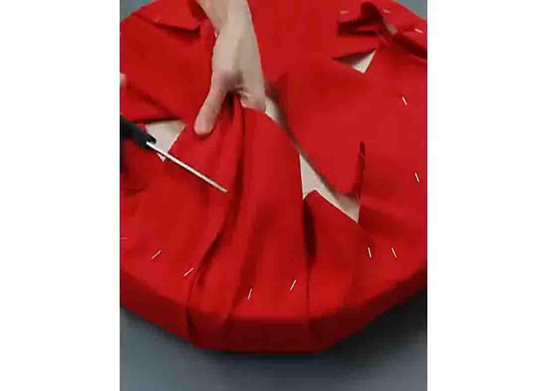 Cutting the excess fabric from the foam seat of the DIY tire seating