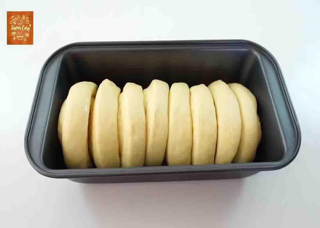 Placing the dough pieces to the loaf pan