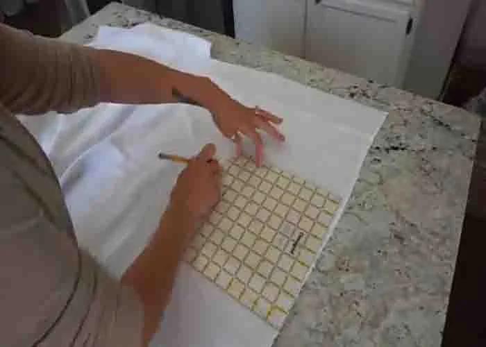 Cutting the square fabric for the DIY dish rags