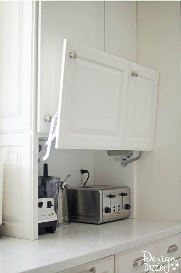 Creative Hidden Storage, a fresh update using paint and new hardware and a practical way to make old cabinets feel new