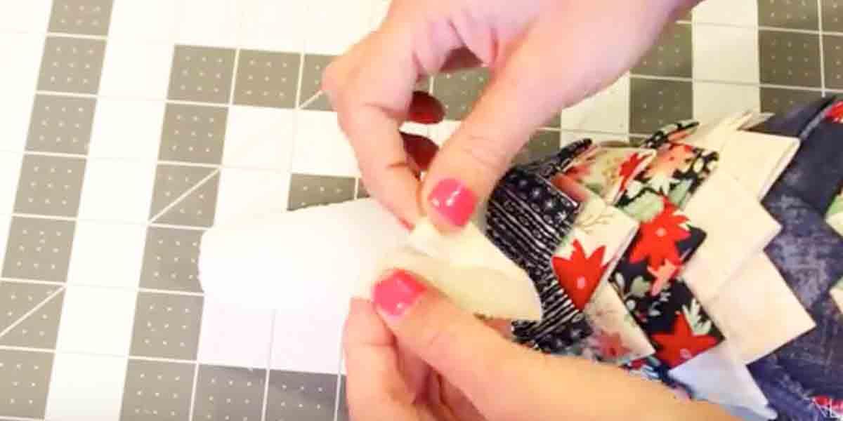 She Attaches Fabric Triangles To A Styrofoam Cone And Makes An Amazing Decoration!