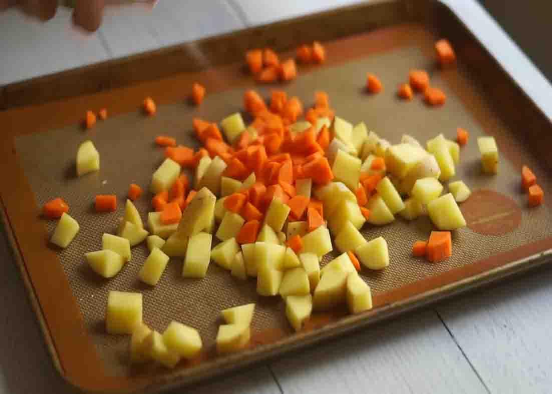 Roasting the carrots and potatoes for the tater tot casserole