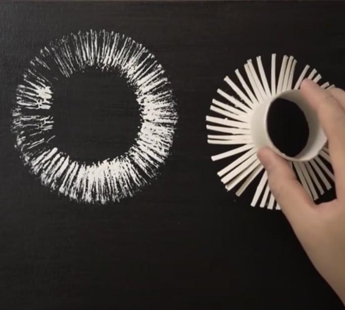 painting dandelions using a paper cup