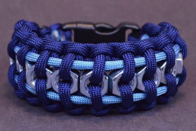 Navy and light blue hex nut bracelet with silver steel hex nuts threaded along the whole length of it