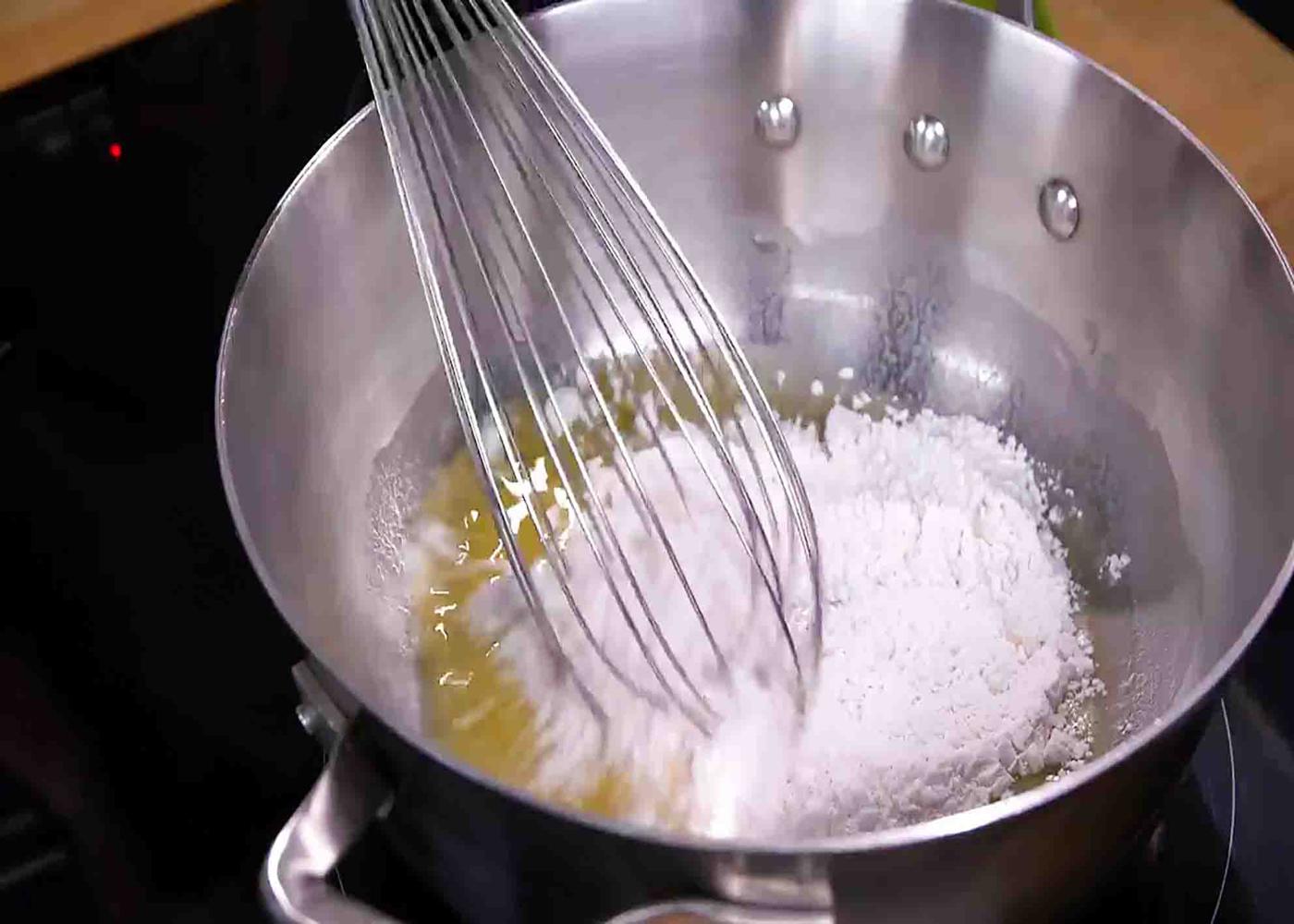 Mixing the flour mixture for 1915 pittsburg potatoes recipe