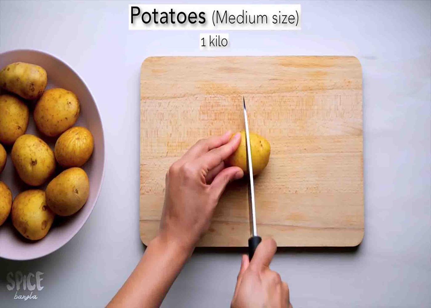 Cutting the potatoes in halves