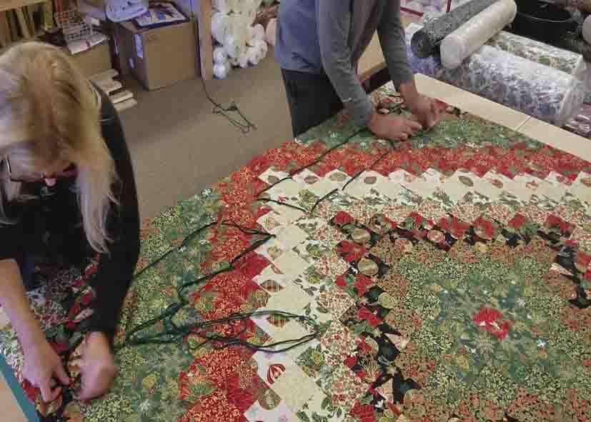 Hand tying the quilt