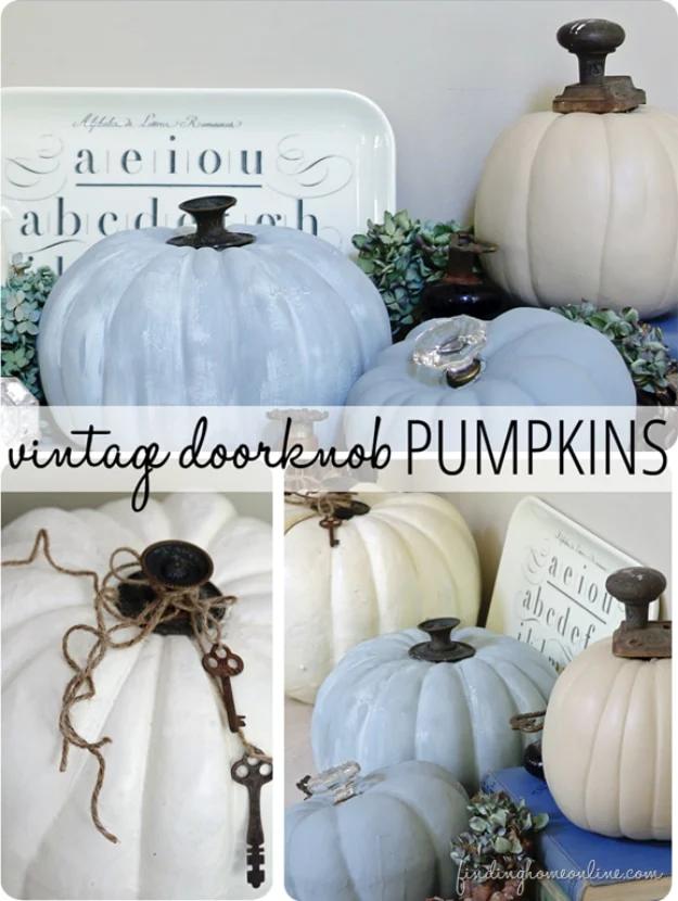 Painted faux pumpkins in beige and two blues, each topped with an old cast metal doorknob for a stem