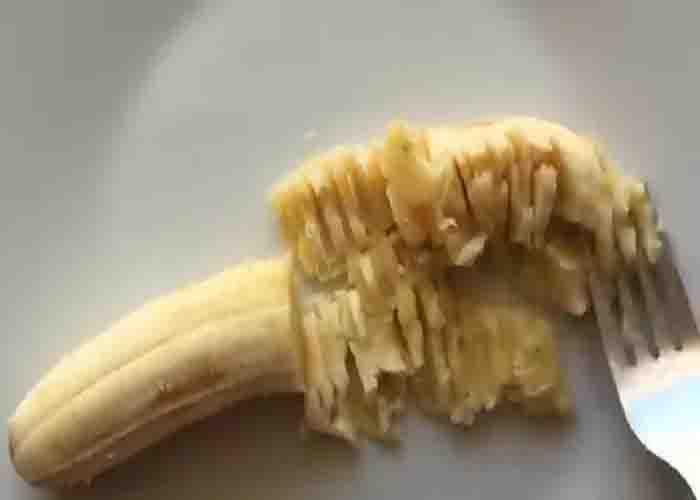 Mashing the bananas for the microwave banana cake recipe
