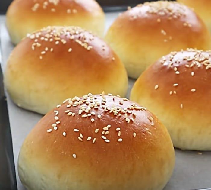 Add Sesame Seeds To The Top Of Homemade Brioche Burger Buns