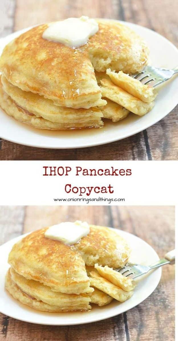IHOP copycat pancakes stacked on a white plate with a pat of butter on top and a fork cutting through