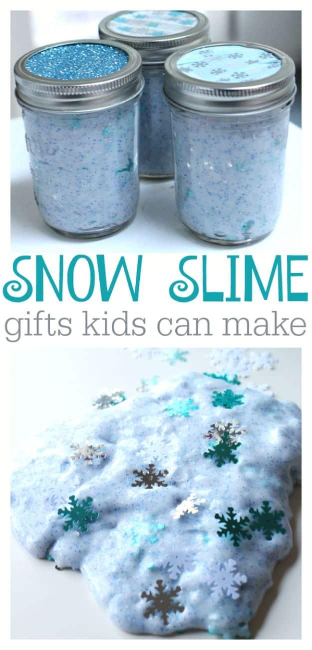 Three mason jars of pale blue glitter slime with snowflake confetti, pin graphic reading Snow Slime gifts kids can make