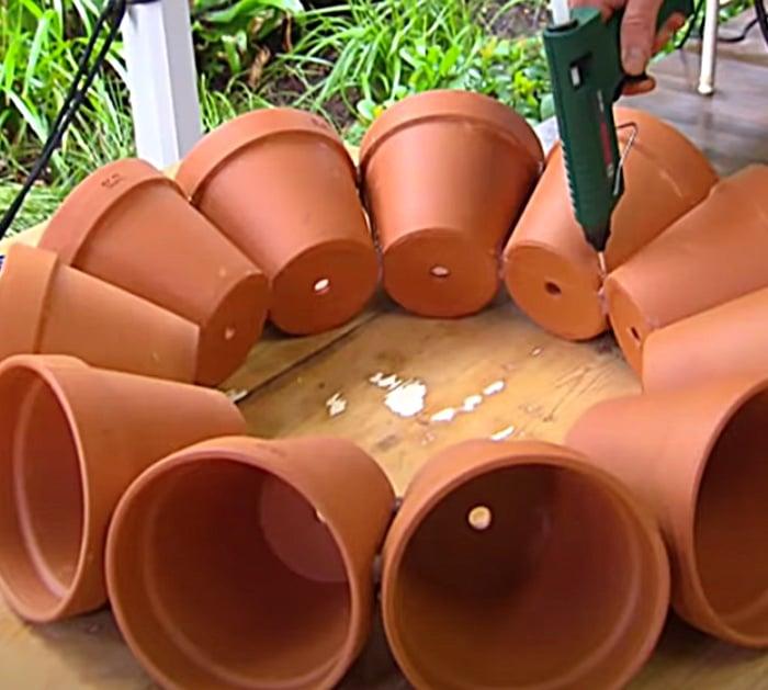 Use a hot glue gun to make this terracotta garden art