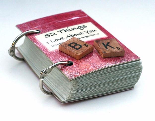 Small handmade book of handwritten notes about someone open on a table as a Valentine's Day gift idea for February 14