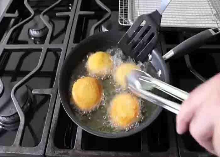 Frying the hot water cornbread