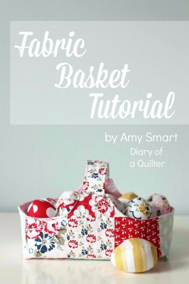 A stiffened fabric basket in cream and mustard cotton holding rolled towels, sewn from fabric you already own at home
