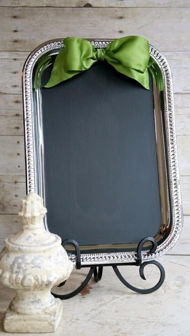 A thrifted wooden tray painted with matte black chalkboard paint, a weekly menu hand lettered across it in white chalk