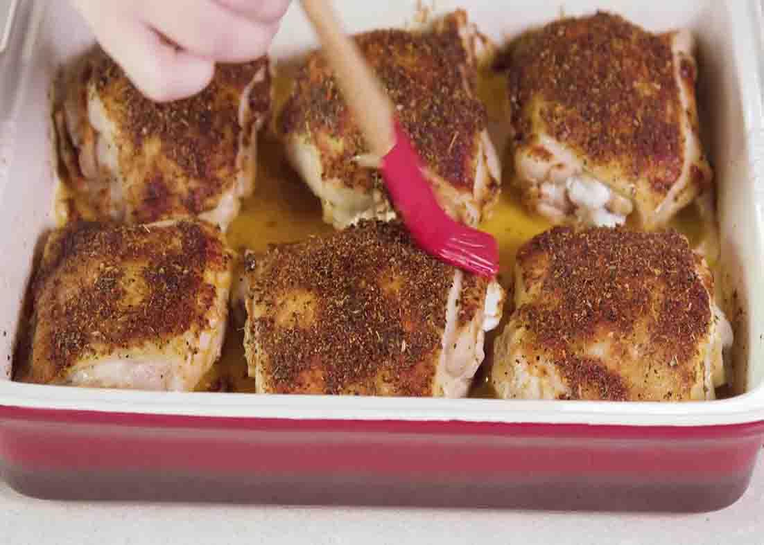 Basting the chicken thighs