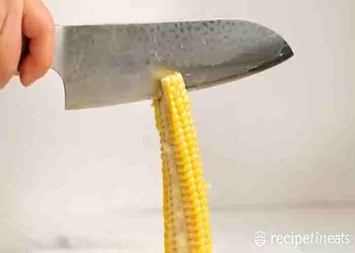 Cutting the corn ribs before grilling them