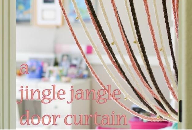 Doorway hung with many strands of finger knitted yarn in cream, pink and brown across a child's bedroom