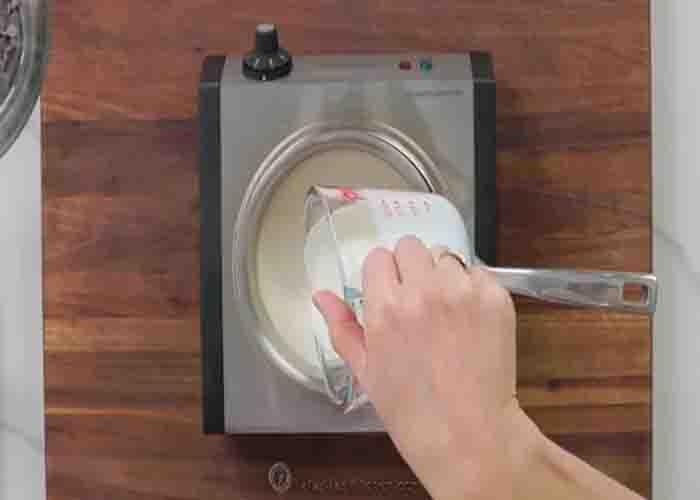 Simmering the heavy cream for the chocolate ganache recipe